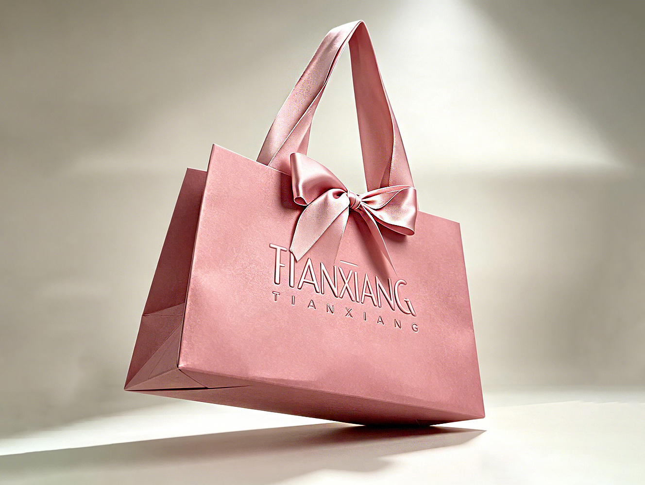 High-quality Custom-designed Luxurious Embossed Craftsmanship Solid-colored Bow-shaped Gift Bag With Silk Handle